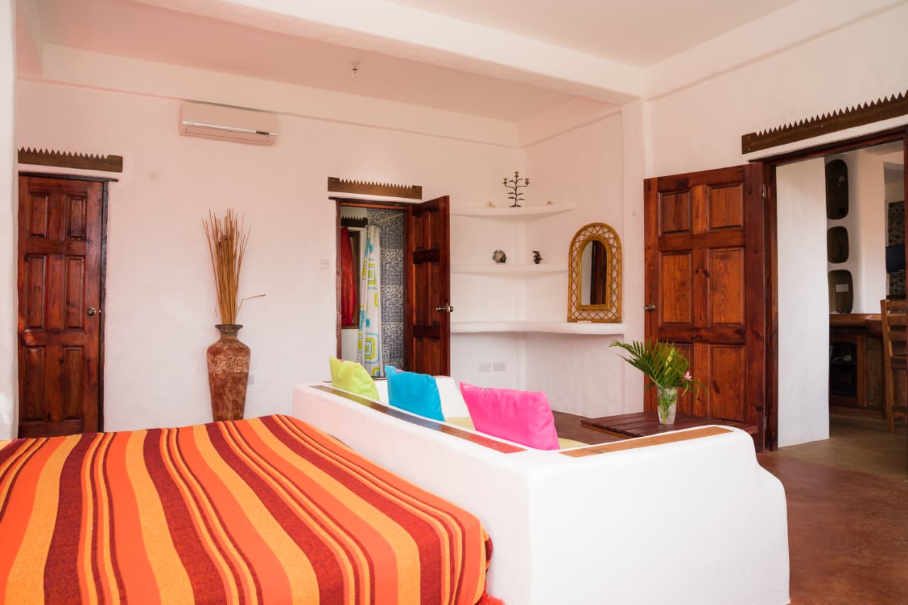 Villa entrance with palms